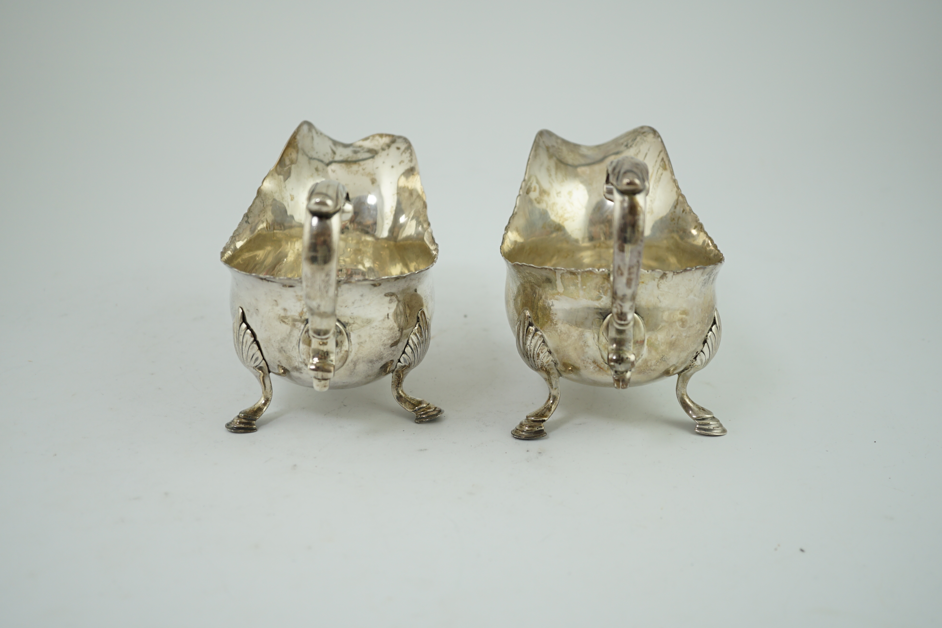 A pair of George III silver sauceboats